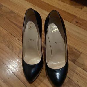 Black leather closed toe 5 inch heels with a 1 inch platform, worn a few times